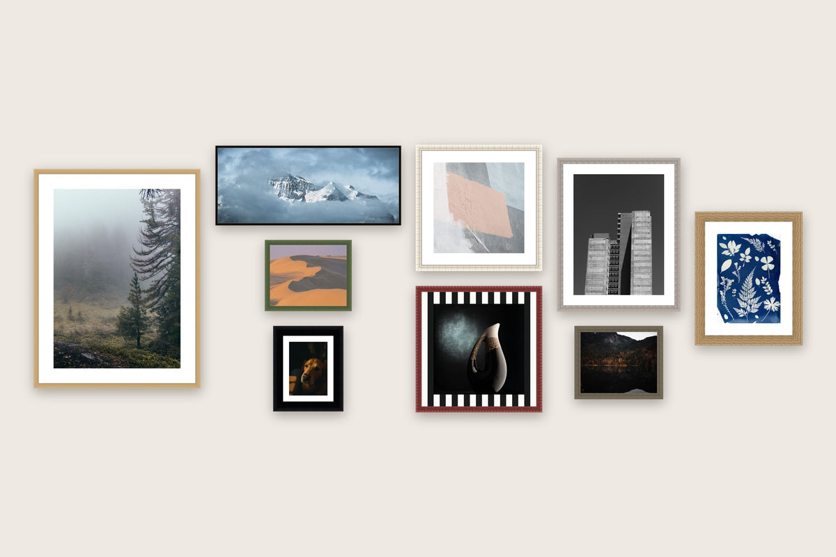 Gallery wall of custom size picture frames from A2 down to 5x7 inches, including a panoramic frame