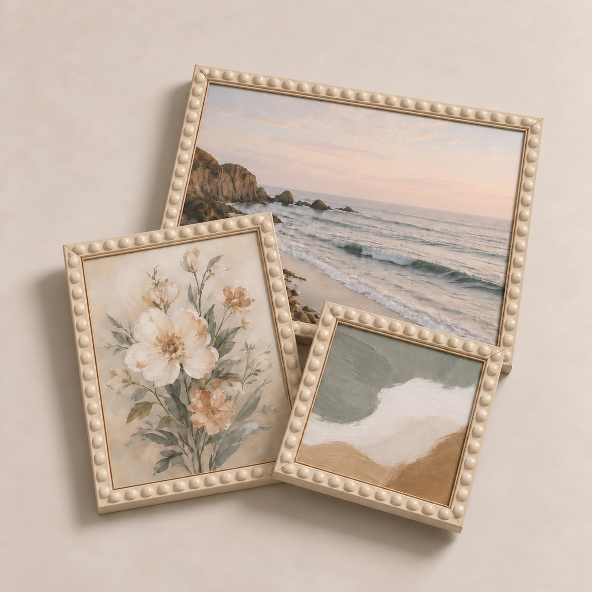 A collection of cream bobbin picture frames lying flat with varied edge-to-edge artwork