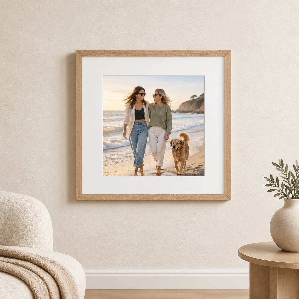 A square oak framed and mounted beach photograph displayed on a warm neutral wall