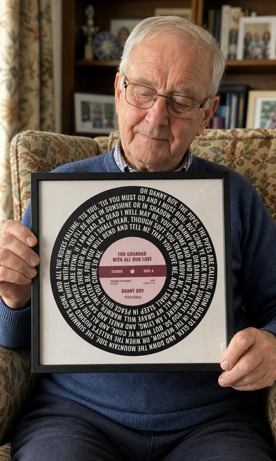 Grandfather holding a personalised Danny Boy vinyl lyrics print