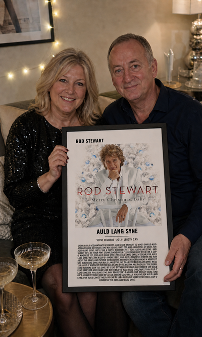 Couple holding a personalised Auld Lang Syne album artwork lyrics print