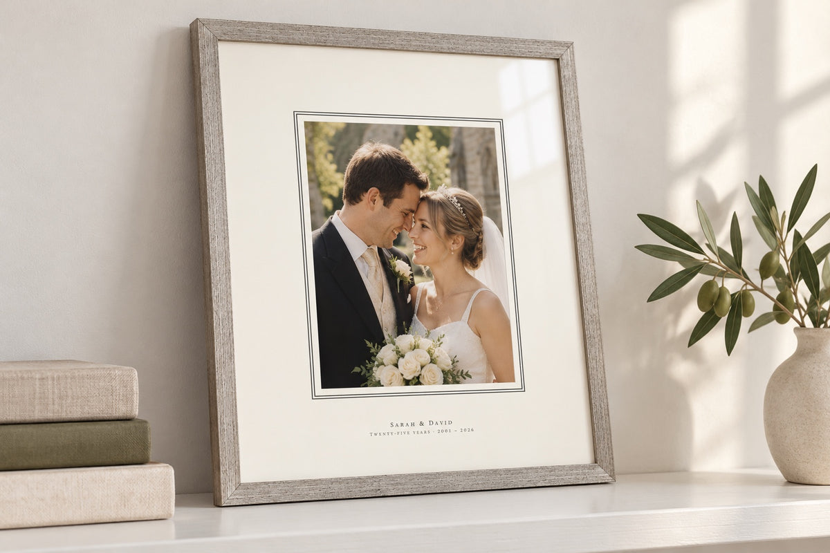 Silver-tone frame with a fine double line around the photo and the names printed on the mount