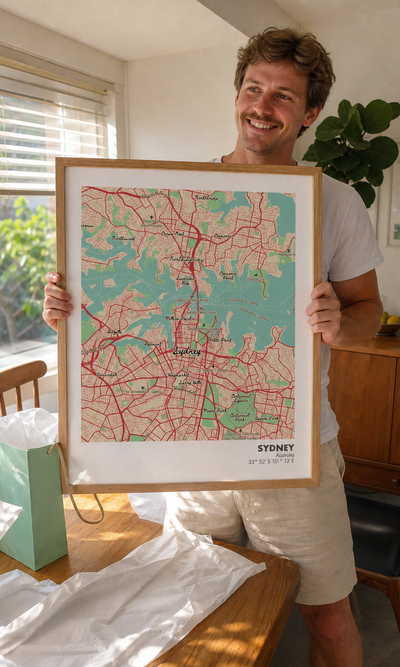 Customer holding a nautical-style personalised Sydney map