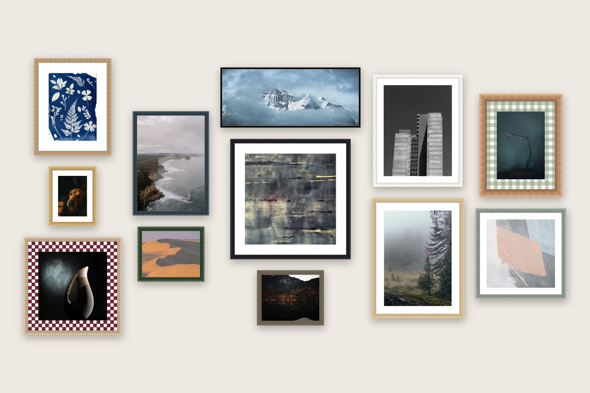 Gallery wall of twelve made-to-measure picture frames in mixed sizes, mouldings and mount boards