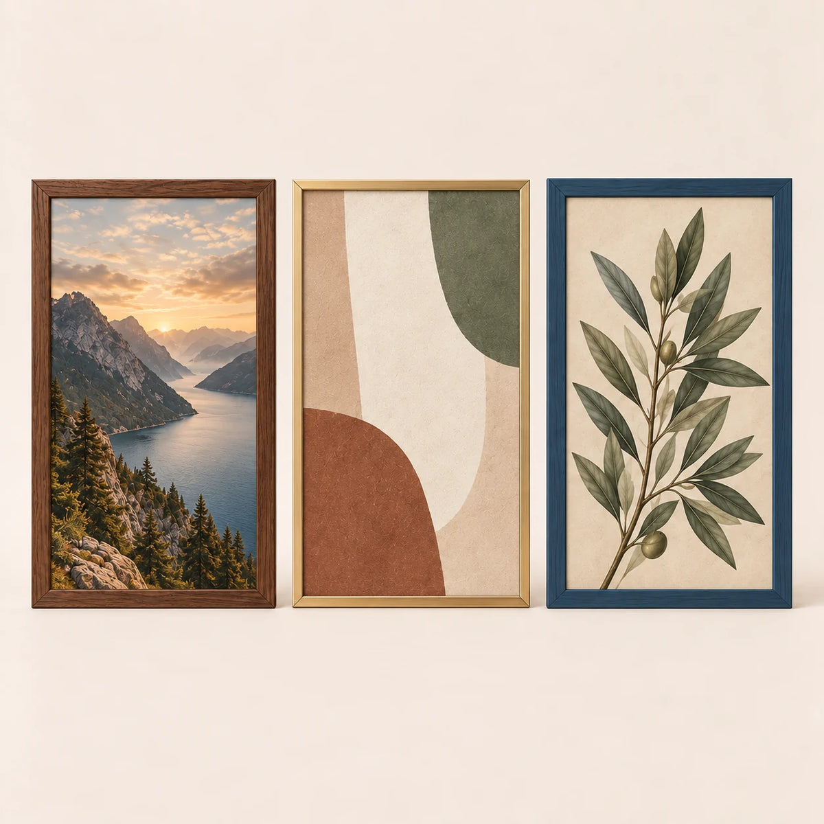 Three 11 by 18 inch picture frames in walnut, champagne brass and slate blue finishes with varied artwork