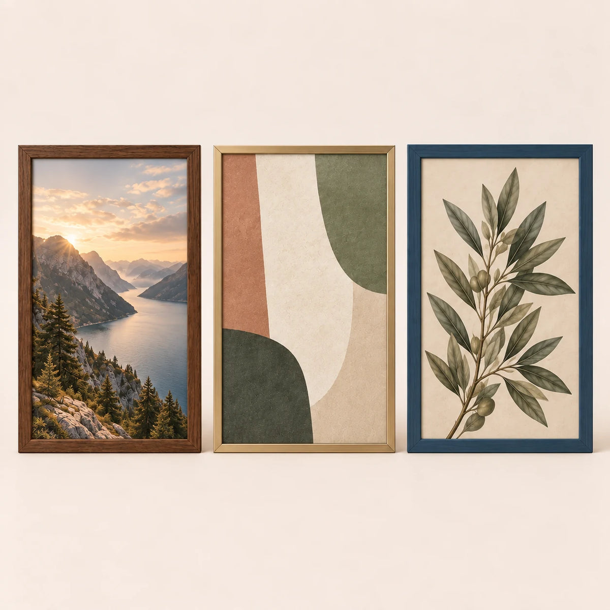 Three 17 by 25 inch picture frames in walnut, champagne brass and slate blue finishes with varied artwork