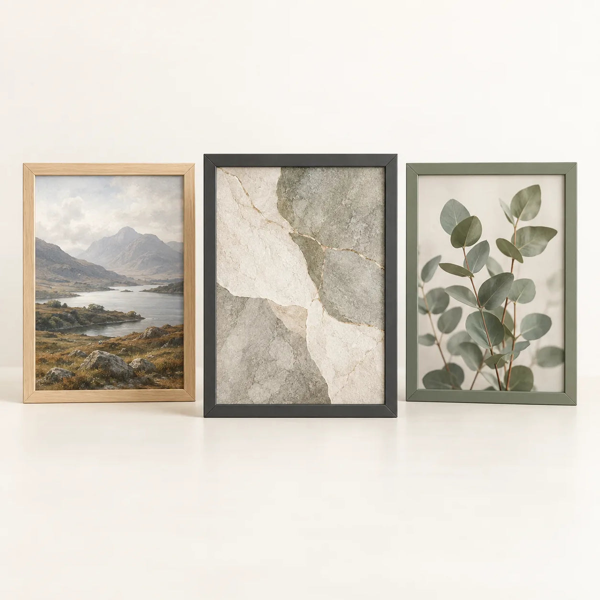 Three picture frames illustrating the 21 by 28 inch size