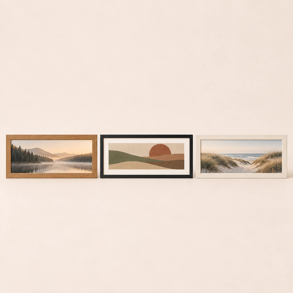 Three 24 by 12 inch panoramic picture frames in oak, black and warm-white finishes with varied artwork