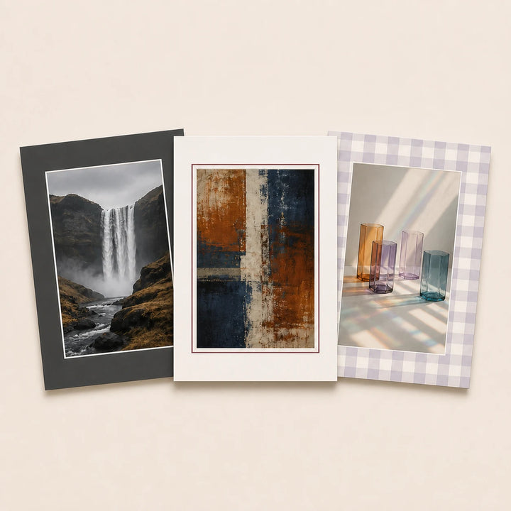 Three large picture mounts in plain and patterned finishes holding varied artwork