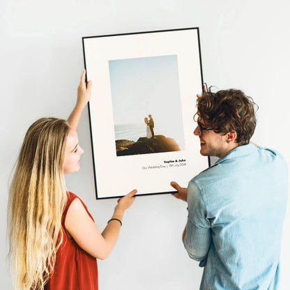 Personalised framed photo print with a caption beneath the photo