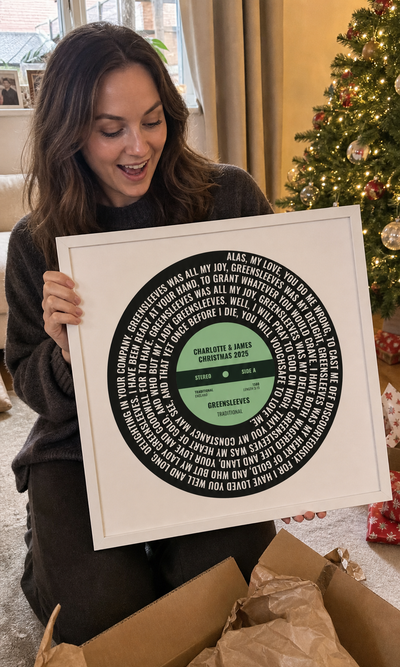 Customer unboxing a personalised Greensleeves vinyl lyrics print